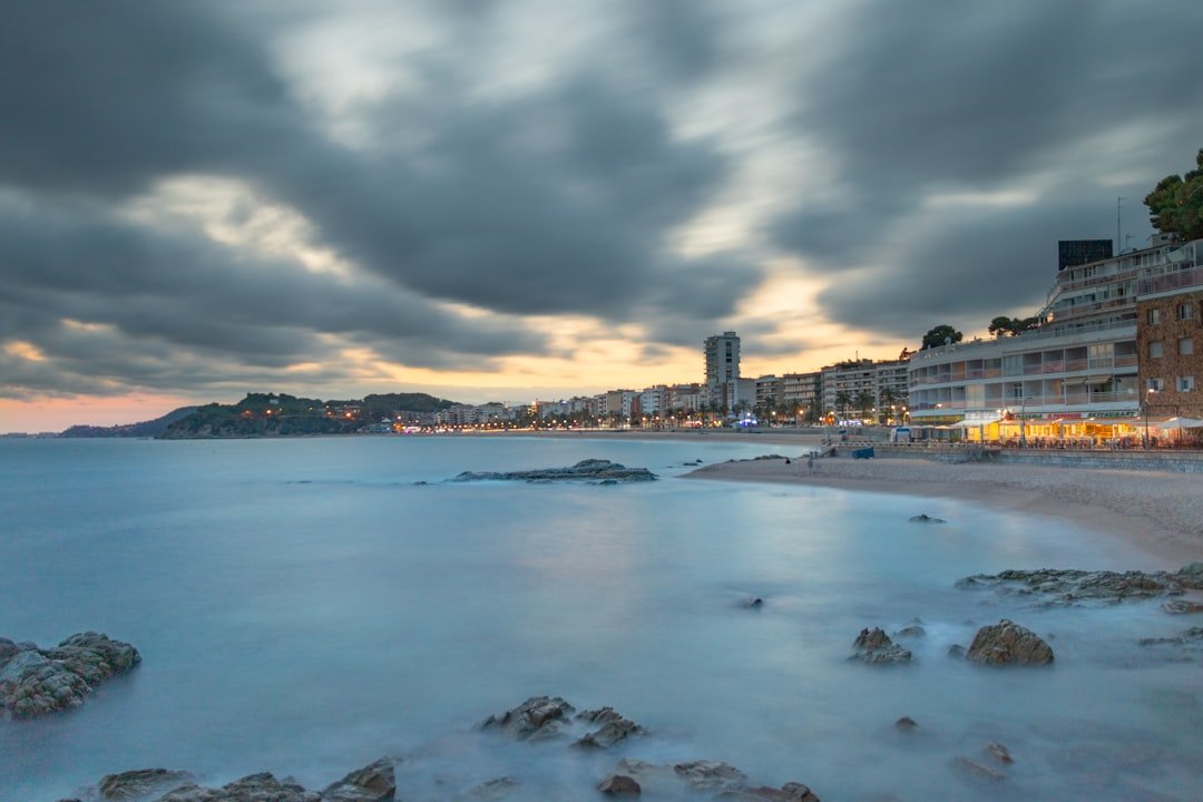 a view of a beach with buildings in the background