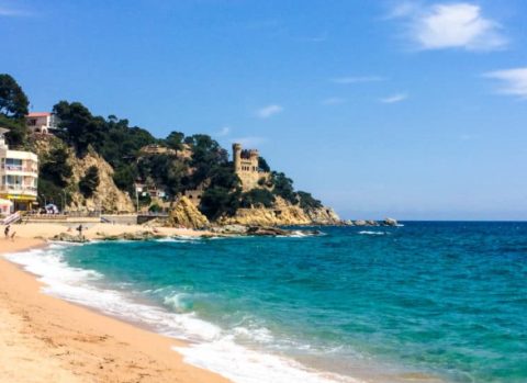 Lloret de Mar main beach with golden sand and Mediterranean blue water