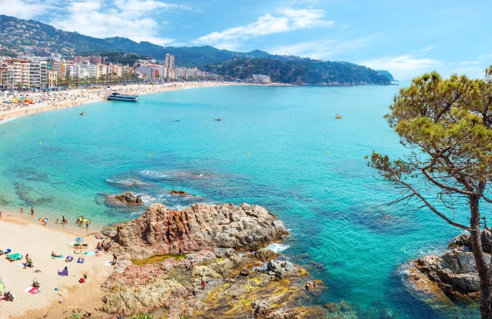 Panoramic view of Lloret de Mar beach with the Costa Brava in the background